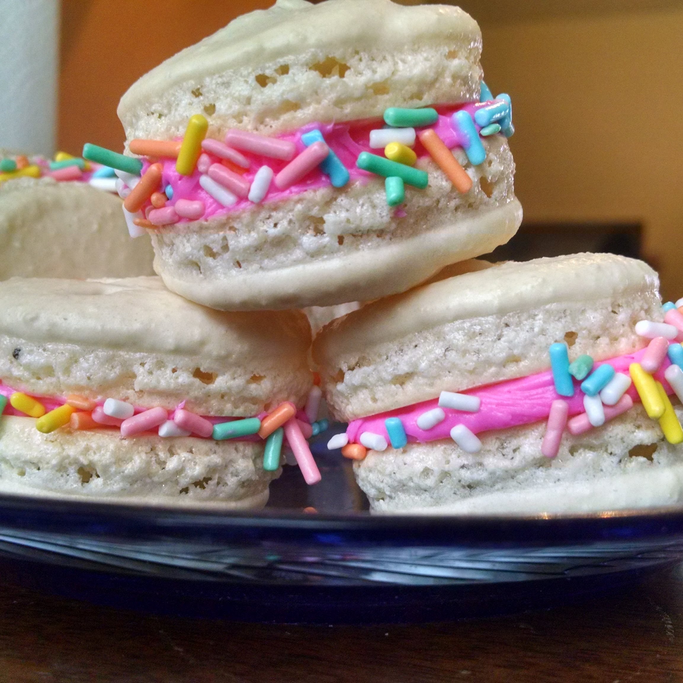 Blizzard white macarons with pink filling and sprinkles